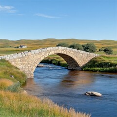 Fototapeta premium Stone Arch Bridge Over Calm River in Green Pastoral Landscape