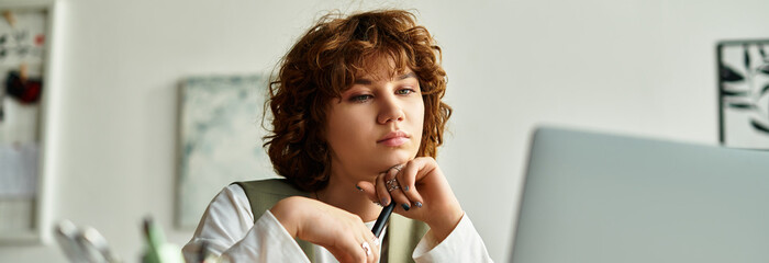 Curly haired freelancer focused on her work from a cozy apartment in summer
