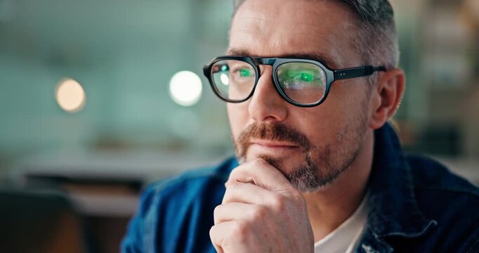 Business, man and laptop with thinking in office for debugging solution, coding and research. Programmer, night and mature person with glasses reflection for software maintenance and problem solving