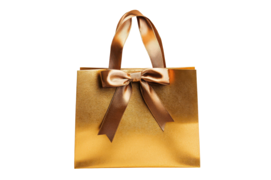 Golden gift bag with bow isolated on transparent background. Stylish golden shopping bag with elegant ribbon handles isolated on white background.