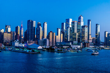 Naklejka premium A view at dusk from the Hudson River towards Hudson Yards in Manhattan, New York, in the fall