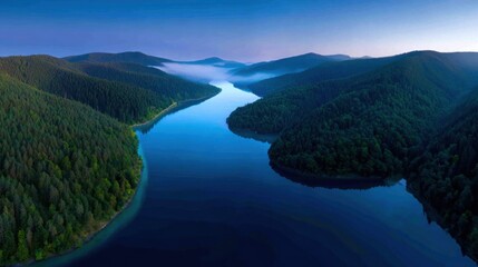 Fototapeta premium Stunning aerial panorama of mountain lake, crystal blue water, surrounded by evergreen forests, dramatic sunrise, misty atmosphere, breathtaking scenery, perfect for stock photos