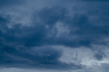 Textured Backdrop of Dark Blue and Grey Clouds Before a Storm. Concept Atmospheric texture
