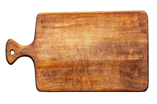 Rustic wooden cutting board with handle isolated on transparent background. Top view of an empty wooden cutting board with a handle isolated on white background.