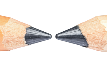 Two sharpened pencils meeting tip to tip isolated on transparent background. Two pencils facing each other isolated on white background.