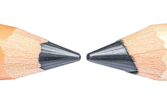 Two sharpened pencils meeting tip to tip isolated on transparent background. Two pencils facing each other isolated on white background.