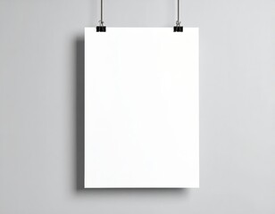 Blank white poster hanging up with clips mockup