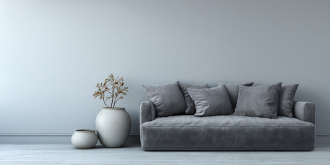 Plush gray sofa with decorative vases and dried plant couch cushions