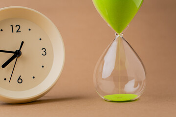 Hourglass tells the time of life and work, punctuality and using time wisely. Time photograph.
