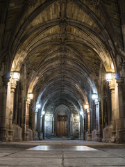 Gothic Stone Archway with Lantern Lighting at Night