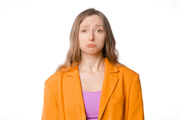 disheartened, dejected and downcast young woman standing on a white background. Concept of sadness,...