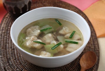 Traditional Korean clear soup made with lions mane mushroom and vegetables in light broth. A clean dish by Hanshunseop.