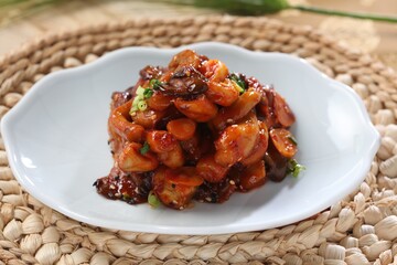 Oyster mushrooms pickled in aged soy sauce, known for gut support and fiber. A dish by Master Chef Hanshunseop. Photographed in Korea.