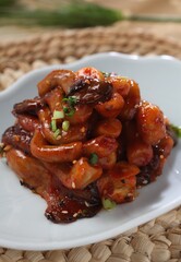 Spicy chili-glazed oyster mushroom pickle made with soy and vinegar. Bold and detoxifying. A dish by Master Chef Hanshunseop. Photographed in Korea.