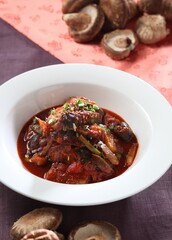 Traditional Korean braised mackerel dish with pine mushrooms and bold chili sauce. Deep flavor and spice. A dish by Master Chef Hanshunseop. Photographed in Korea.