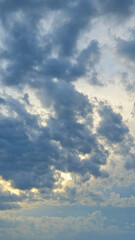 Dark clouds on light sky background