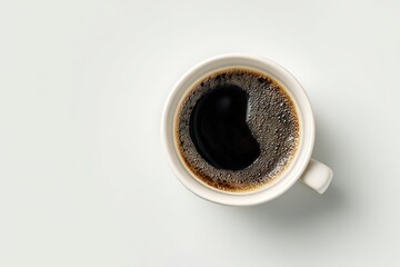 Overhead view of a white coffee cup filled with dark coffee