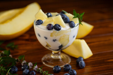 Healthy breakfast yogurt melon blueberry on wooden