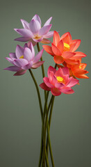Fototapeta premium A bouquet of vibrant pink, purple, and orange lotus flowers with delicate petals and yellow centers