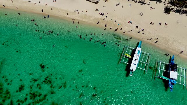 Seven commandos beach in El Nido, Palawan, Philippines islands. Aerial 4K drone video footage. Top view of beautiful turquoise beach, with white sand and palms
