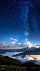 Fototapeta premium Starry night over misty mountains
