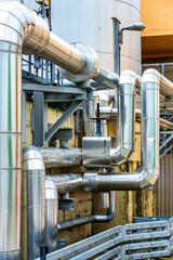 Large metal ductwork installation in a commercial facility highlighting ventilation systems and air...