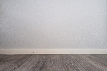 laminate flooring and wallpapered wall for background use