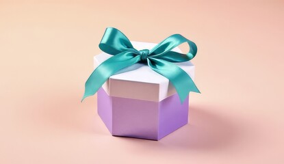 Obraz premium Elegant hexagon gift box adorned with a luxurious teal satin bow, perfect for celebrations