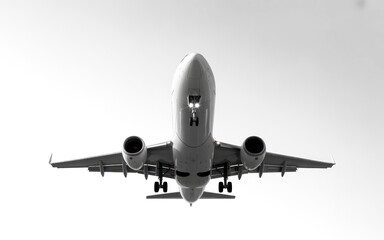 Fototapeta premium Airplane Approaching from Below in Black and White