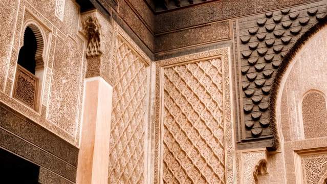 Warm-toned stone carving with Arabic architectural detail