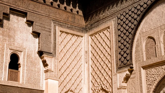 Intricate Islamic geometric carving in warm sunlight