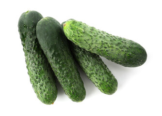 Many fresh green cucumbers isolated on white, top view