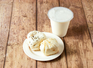 Set Meal of Pan Fried Buns and a Refreshing Drink in plate and glass side view of taiwan food