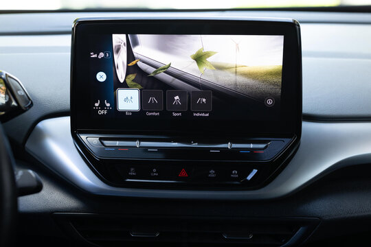 Driving mode button on luxury electric car. Eco mode is a relaxed and comfort sport is a fuel efficient driving mode. Smart electric vehicle concept. Sport Mode button of a car. Pressing the button