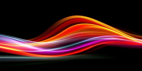 Vibrant abstract light trails in bold colors on a dark background.