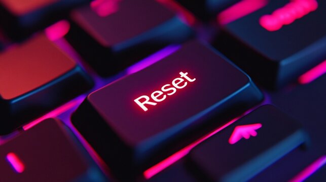 Close-up of a glowing reset key on a modern keyboard