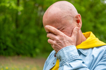 Elderly Sad senior man emotional pain crying alone showing vulnerability and sadness, sorrow...