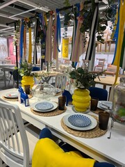 Osnabruck, Germany - July 15, 2025: Colorful dining table setup with decorative ribbons, vibrant...