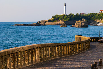 Obraz premium Lighthouse at Pointe Saint-Martin Seen from the Rocher du Basta in Biarritz