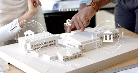 Architects tapping model activating cycling currency icons for finance comparison - Powered by Adobe