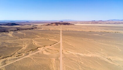 Fototapeta premium Aerial View Of Remote Desert With Clean Horizon And Clear Sky