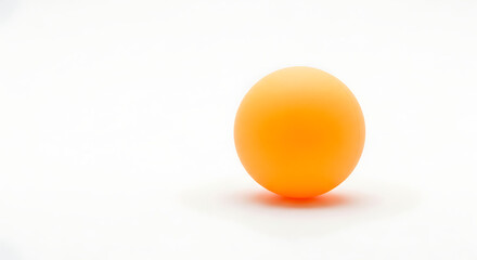 A single orange ping pong ball is sitting on a white surface with a soft shadow underneath it ai generated