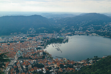 view of the city of como from top amove with como lake tail bay italian alps in autumn