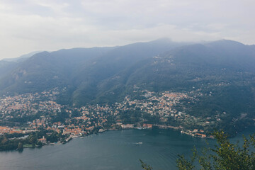 Obraz premium view of the city of como from top amove with como lake tail bay italian alps in autumn