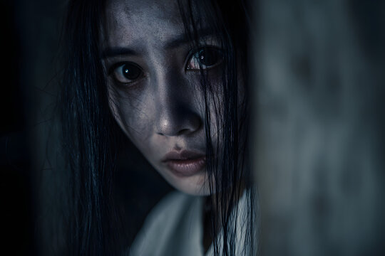 Portrait of asian woman make up ghost,Scary horror scene for background,Halloween festival concept,Ghost movies poster