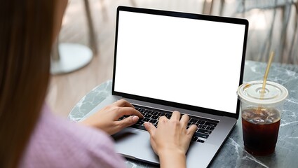 Woman typing on laptop with coffee adult beverage