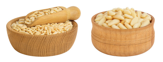 Shelled European pine nuts in wooden bowl and scoop isolated on white background with full depth of field