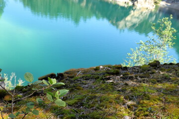 Limestone quarry lake with turquoise water. Summer day in Uskavi, Nora, Bergslagen, Sweden.