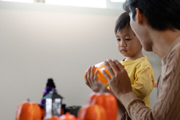 Father and Son Exploring Halloween Treats Together
