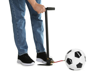 Man inflating soccer ball with manual air pump on white background, closeup